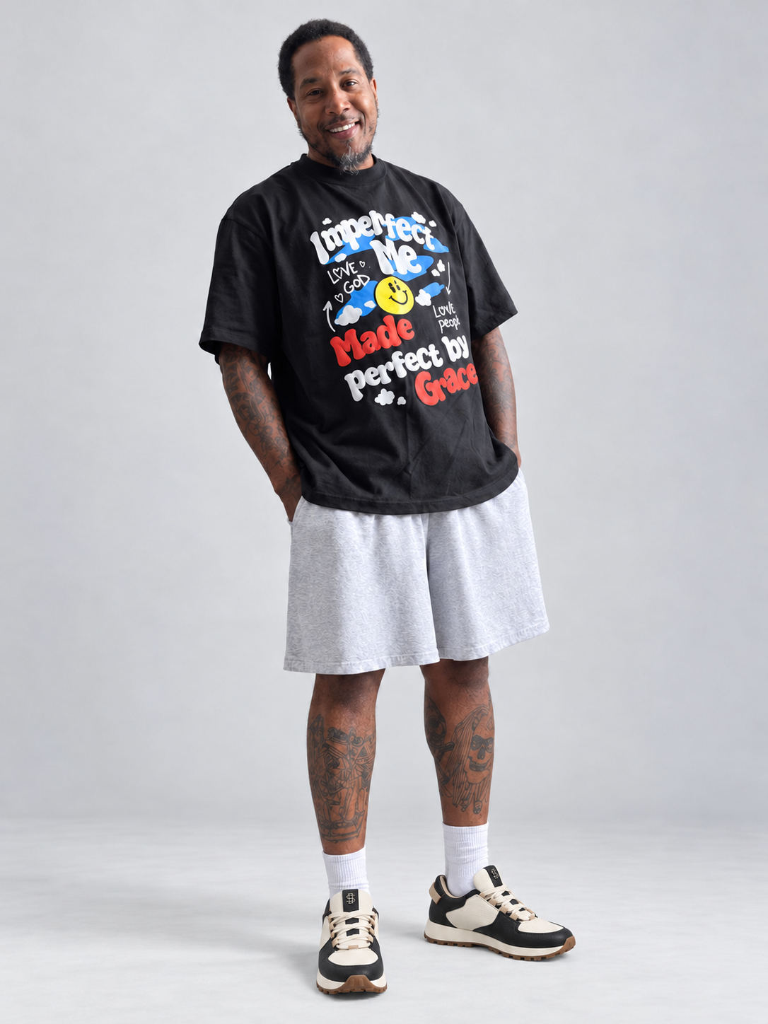Sincerely BeMore grace tee smile wearing black and cream sneakers