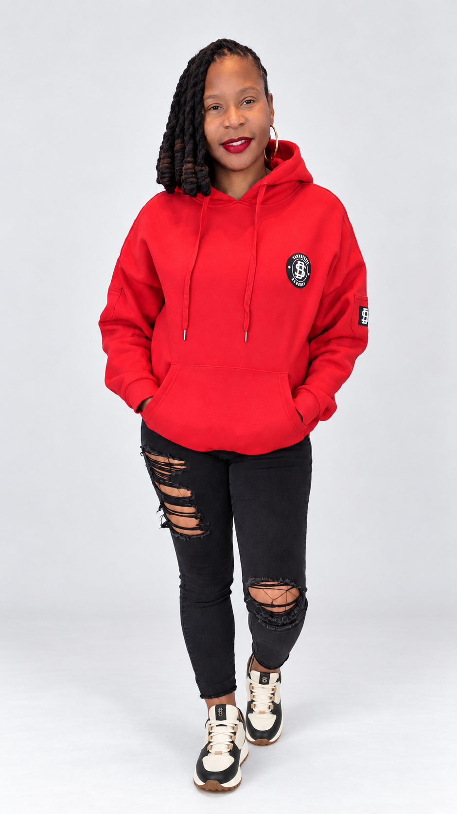 Sincerely BeMore red hoodie woman wearing black and cream sneakers